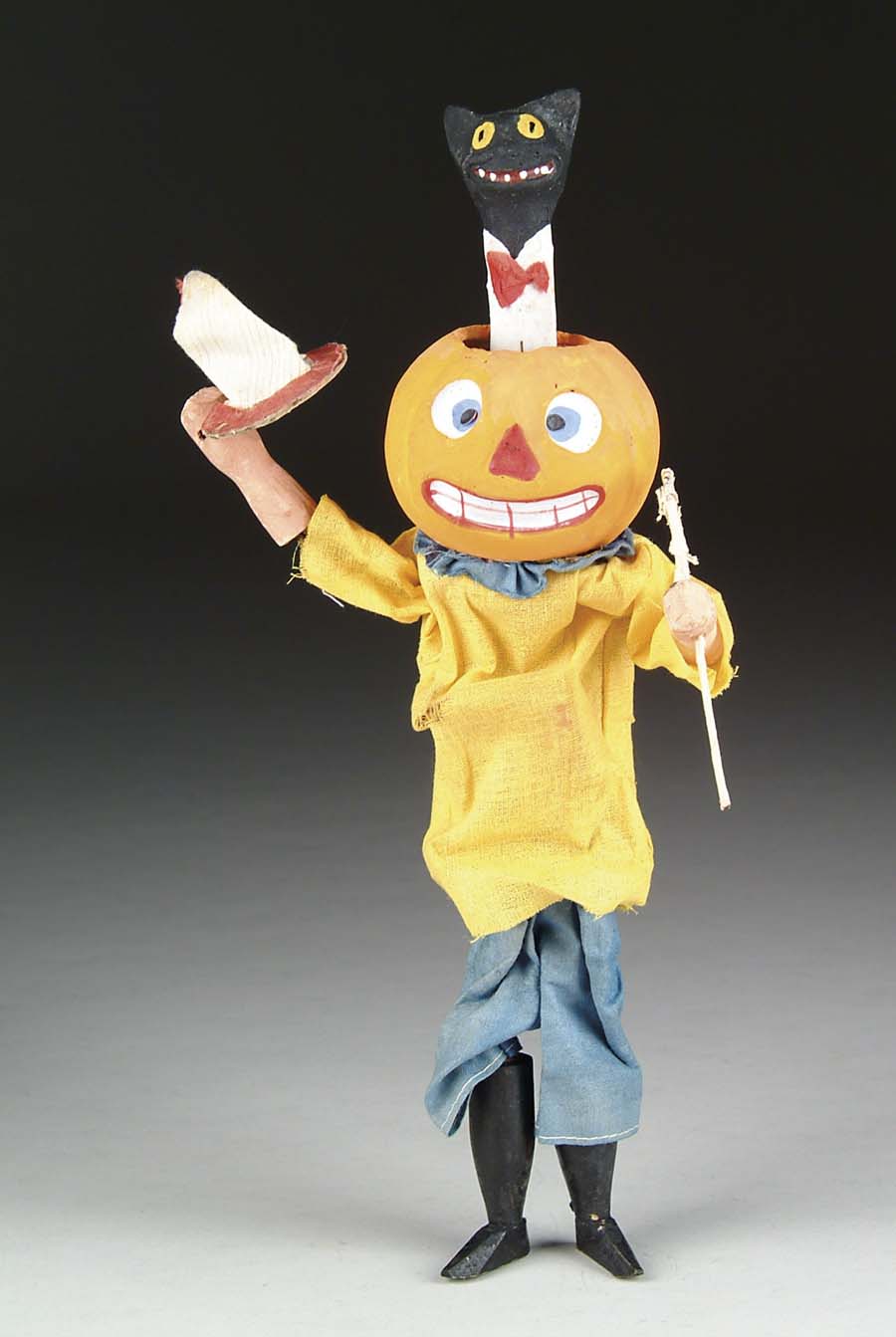 Appraisal: PUMPKIN-HEAD ANIMATED FIGURE Bizarre composition jack-o-lantern figure with nodding cat