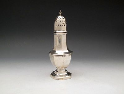 Appraisal: A silver sugar caster by Walker and Hall Sheffield octagonal