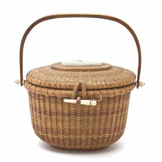 Appraisal: A Nantucket Purse Basket Mike Kane having a swing handle