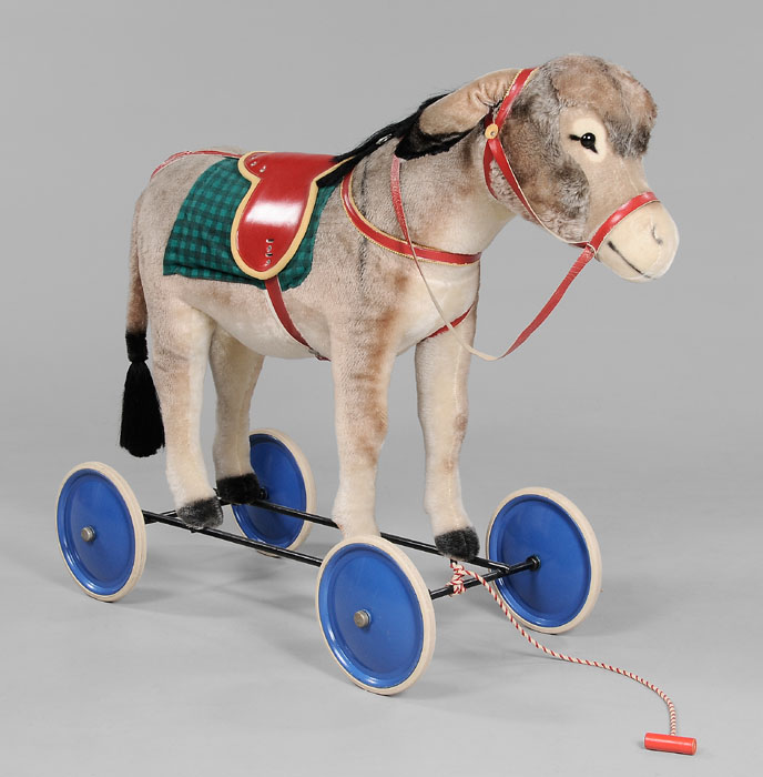 Appraisal: Steiff Donkey on Wheels German late th century stuffed fabric