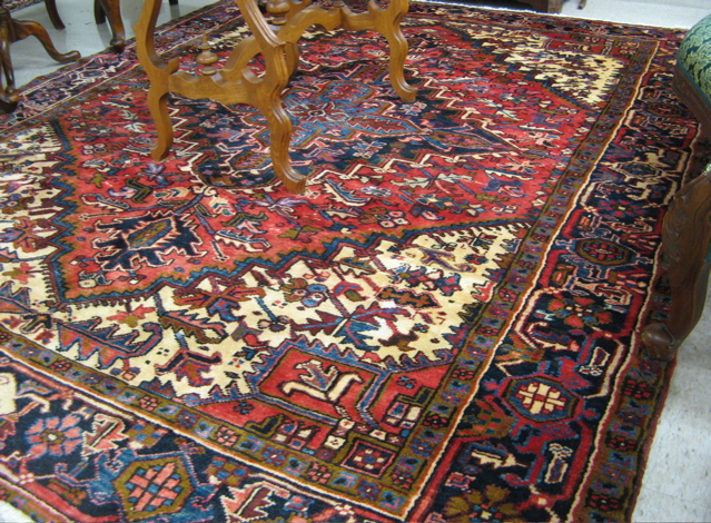 Appraisal: PERSIAN HERIZ CARPET Azarbaijan province northwestern Iran centering a cruciform