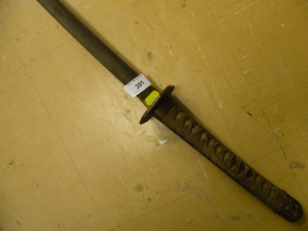 Appraisal: A Japanese samurai sword shagreen handle with bronzed mountblade length