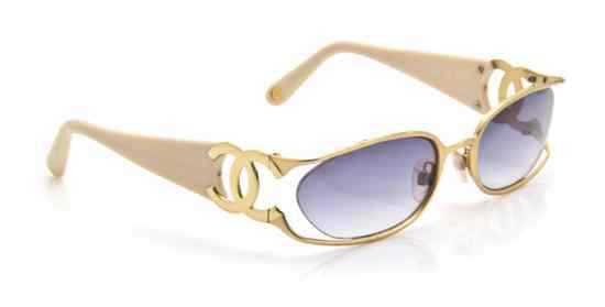 Appraisal: A Pair of Chanel Sunglasses brushed goldtone rims openwork logo