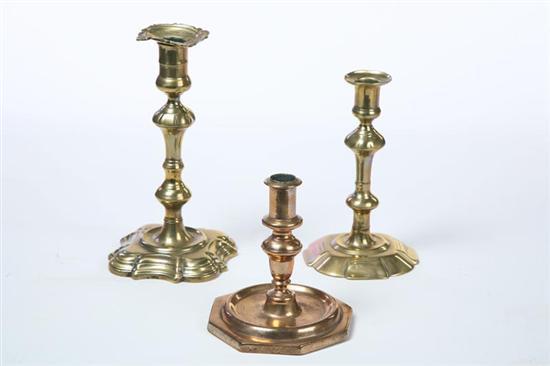 Appraisal: THREE BRASS CANDLESTICKS English mid th century Seamed construction Small