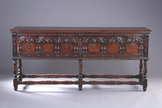 Appraisal: KITTINGER TUDOR REVIVAL SIDEBOARD th century With two-drawer arcaded facade