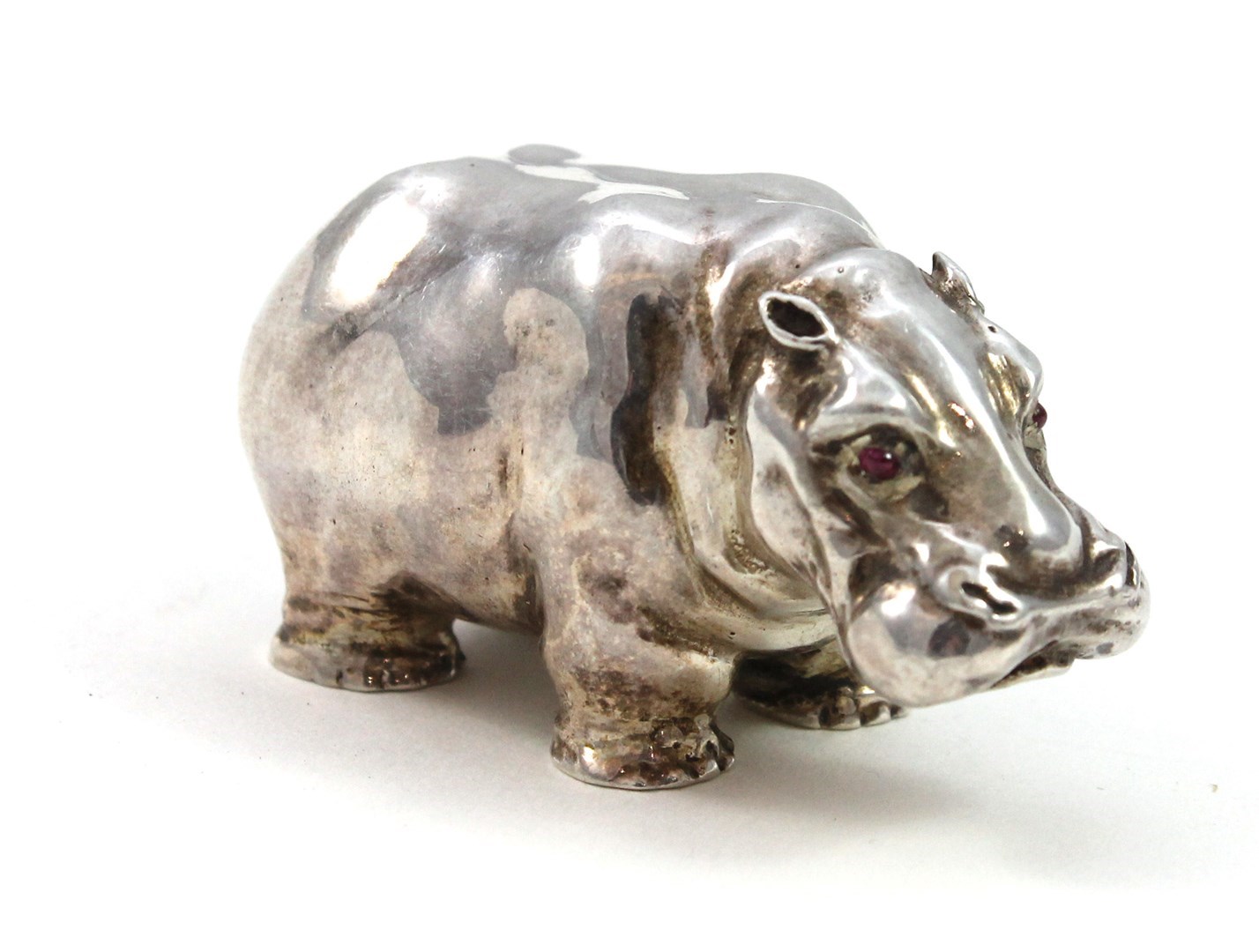 Appraisal: A silver model of a standing hippopotamus with cabochon ruby