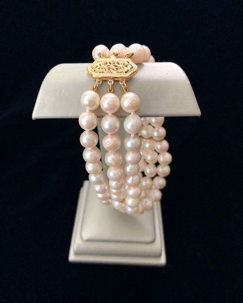 Appraisal: White Fresh Water Pearl Triple Strand Bracelet with k Yellow