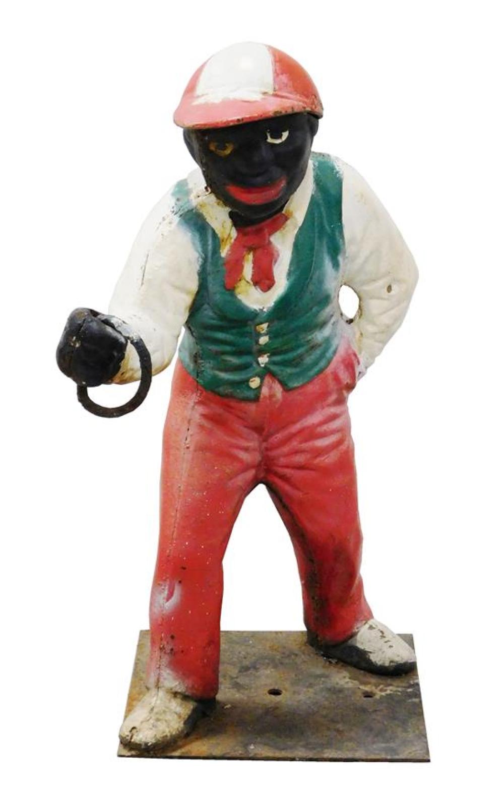 Appraisal: BLACK AMERICANA Cast iron lawn jockey c painted red white