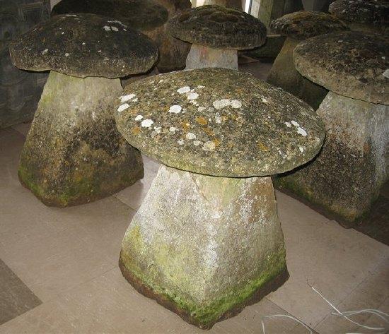 Appraisal: Two th Century Cotswold stone staddle stones with square tapering