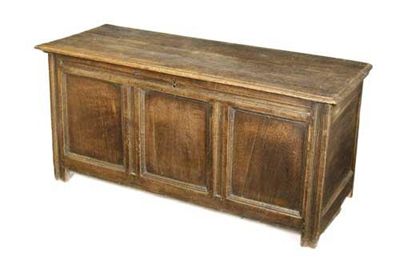 Appraisal: An early th century oak chest the hinged lid to