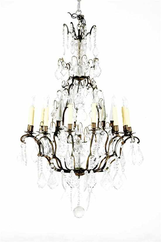 Appraisal: Austrian bronze and crystal sixteen-light chandelier early th century scrolling