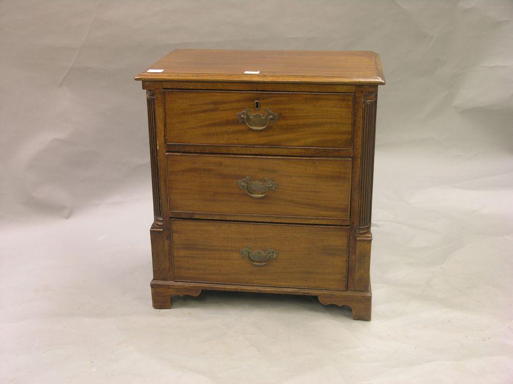 Appraisal: A small late George III mahogany chest three drawers with