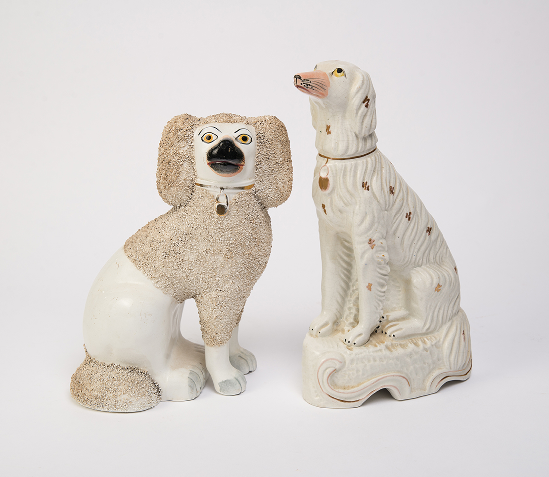 Appraisal: TWO STAFFORDSHIRE DOGS England nd half- th century Poodle with