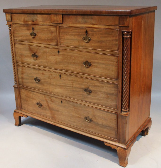 Appraisal: An early thC mahogany chest the rectangular overhanging top with