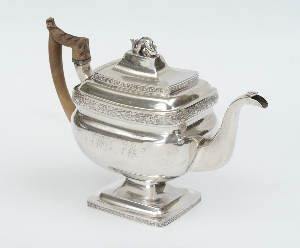 Appraisal: STERLING SILVER TEAPOT Traditional shape with rose border and dolphin