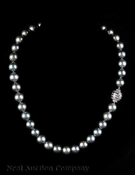 Appraisal: A Necklace of - mm Black Tahitian Pearls with a