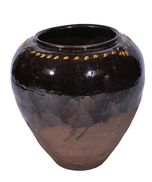 Appraisal: A LARGE BROWN GLAZED TERRACOTTA OVOID JAR cm tall