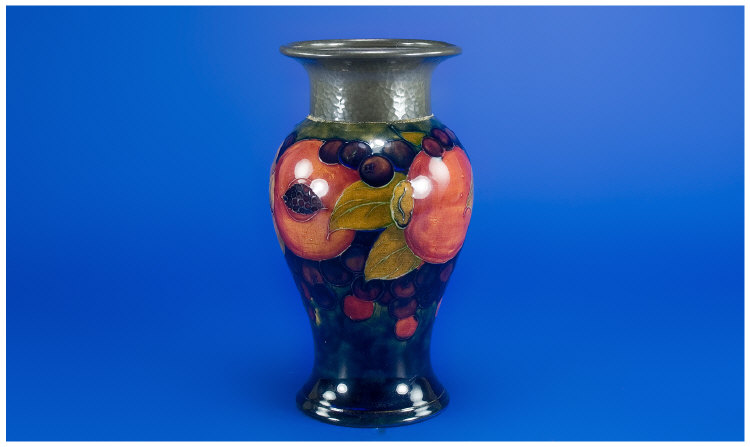 Appraisal: William Moorcroft Pomegranate Design Vase with a Pewter Collar circa