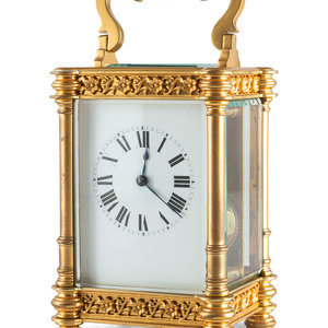 Appraisal: A French Ormolu Filigree Carriage Clock Circa s with an