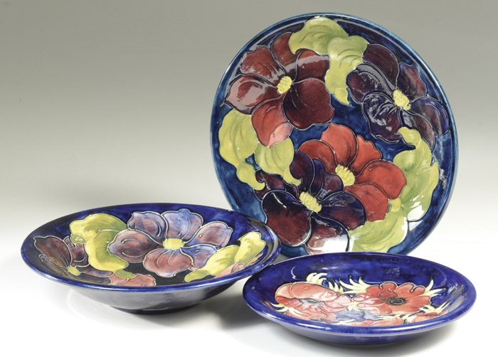 Appraisal: MOORCROFT POTTERY PLATE AND TWO BOWLS hand painted under glaze