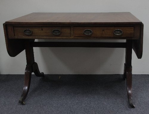 Appraisal: A Regency mahogany two-flap sofa table fitted two drawers to