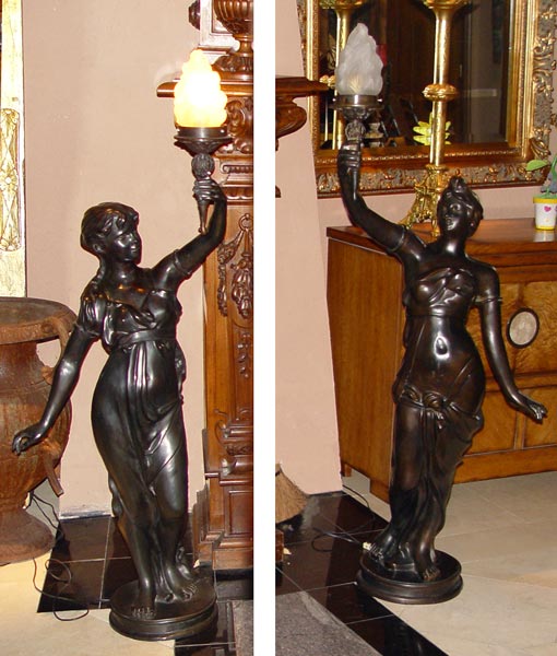 Appraisal: PAIR BRONZE FIGURAL TORCHIERS Similar but not identical female figures