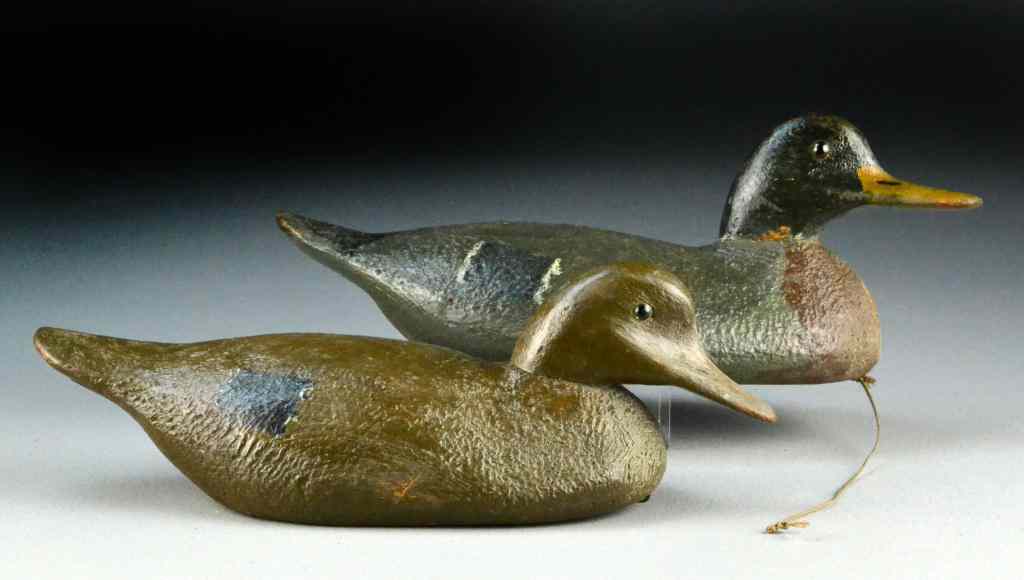 Appraisal: Black Duck Decoys - PairPolychrome painted with glass eyes weighted