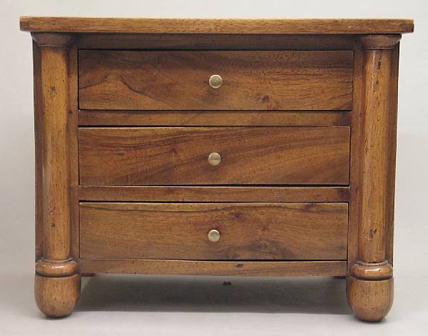 Appraisal: A French walnut miniature commode The rectangular top with three