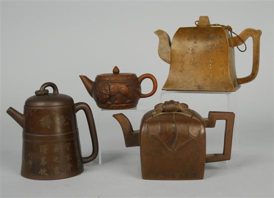 Appraisal: THREE CHINESE YIXING TEAPOTS and a WINE POT two inscribed