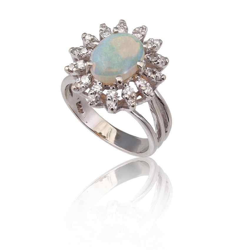 Appraisal: OPAL FRAMED IN DIAMONDS RING K white gold ring contains