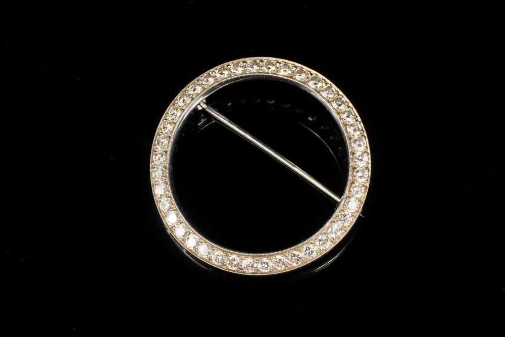 Appraisal: BROOCH - One handmade platinum circle brooch set with round