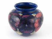 Appraisal: A Moorcroft vase pansy pattern on dark blue ground Impressed