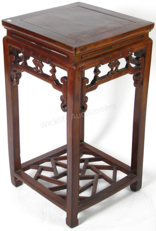 Appraisal: A carved mahogany Oriental plant stand with open reticulated design