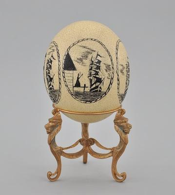 Appraisal: A Decorated Ostrich Egg A large hollow ostrich egg with