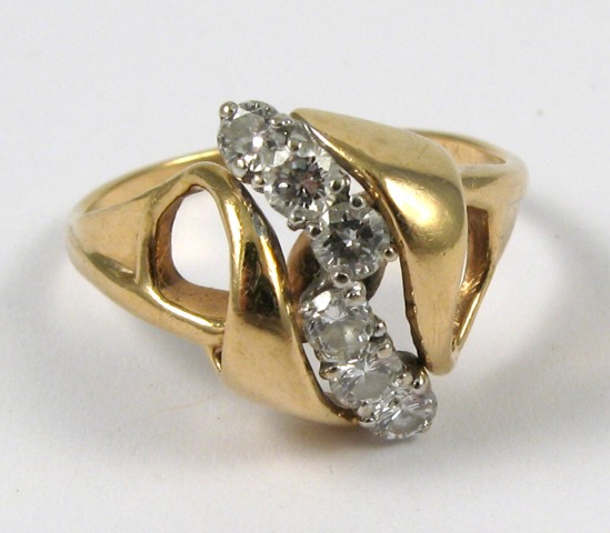 Appraisal: DIAMOND AND FOURTEEN KARAT GOLD RING set with six round-cut