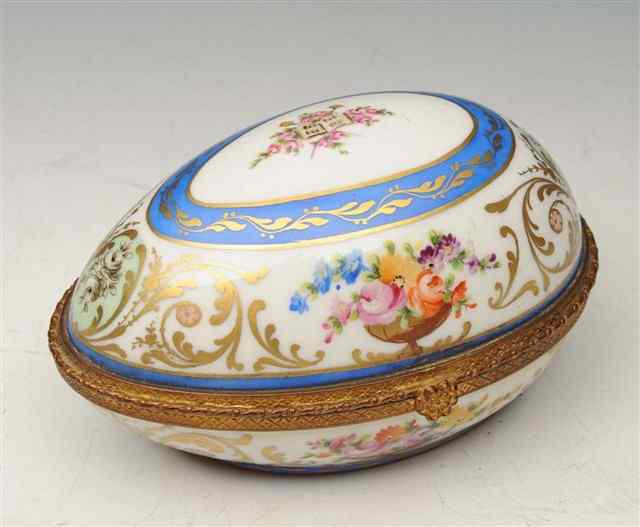 Appraisal: A PARIS PORCELAIN AND FLORAL DECORATED CASKET oviform with gilt