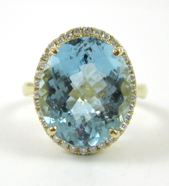 Appraisal: AQUAMARINE AND FOURTEEN KARAT GOLD RING with round-cut diamonds forming