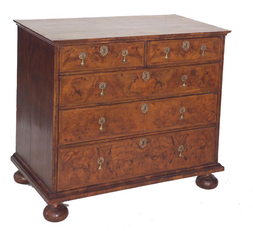 Appraisal: EARLY TH CENTURY WALNUT CHEST OF DRAWERS the quarter-veneered feather-banded