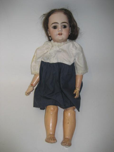 Appraisal: A Heinrich Handwercke bisque head girl doll with fixed brown