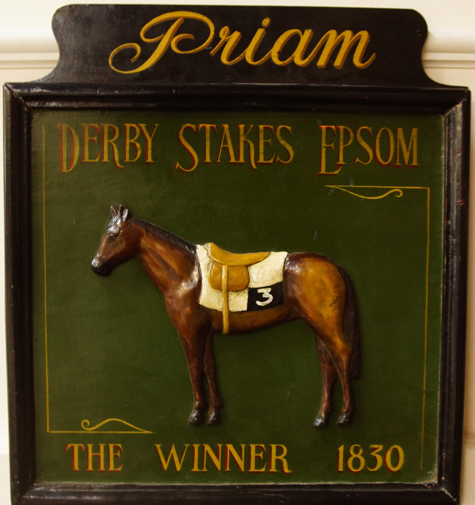 Appraisal: A painted wooden plaque decorated in relief with Priam Derby