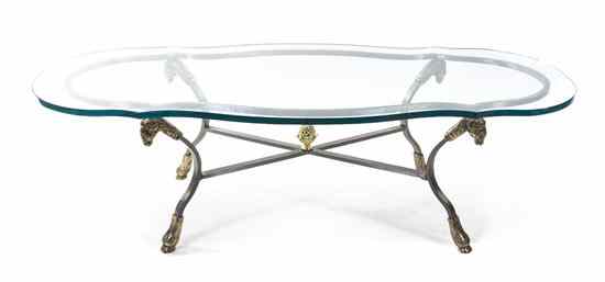 Appraisal: A Neoclassical Steel Brass and Glass Low Table having a