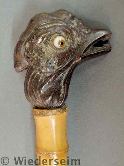 Appraisal: Carved rooster head walking stick late th c with glass