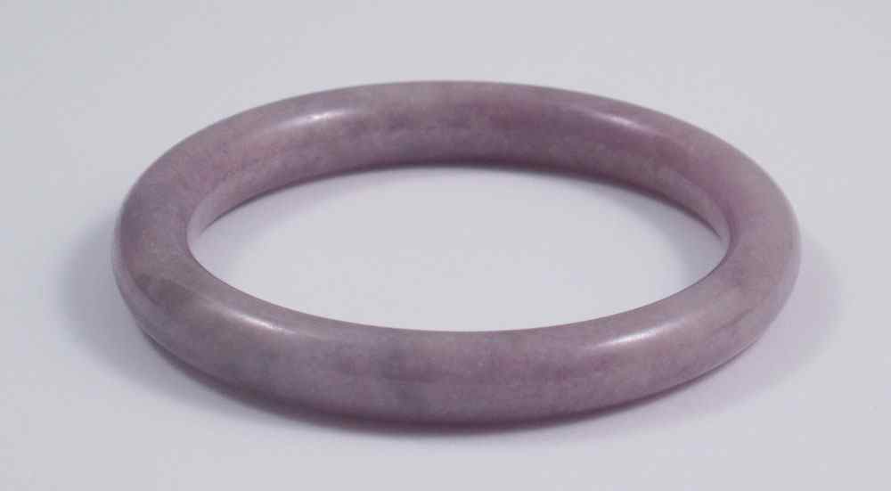 Appraisal: LAVENDER JADE BANGLE BRACELET '' interior diameter