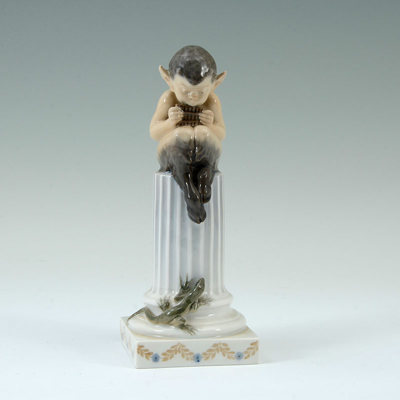 Appraisal: ROYAL COPENHAGEN SATYR ON PILLAR FIGURINE Porcelain figure of a