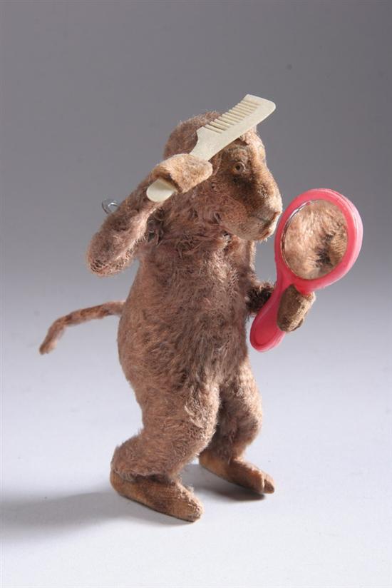 Appraisal: MONKEY WIND-UP TOY Made in Japan Hold mirror and comb