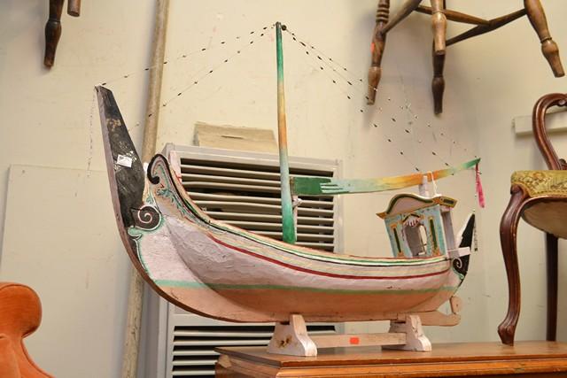 Appraisal: AN ORIENTAL TIMBER MODEL BOAT