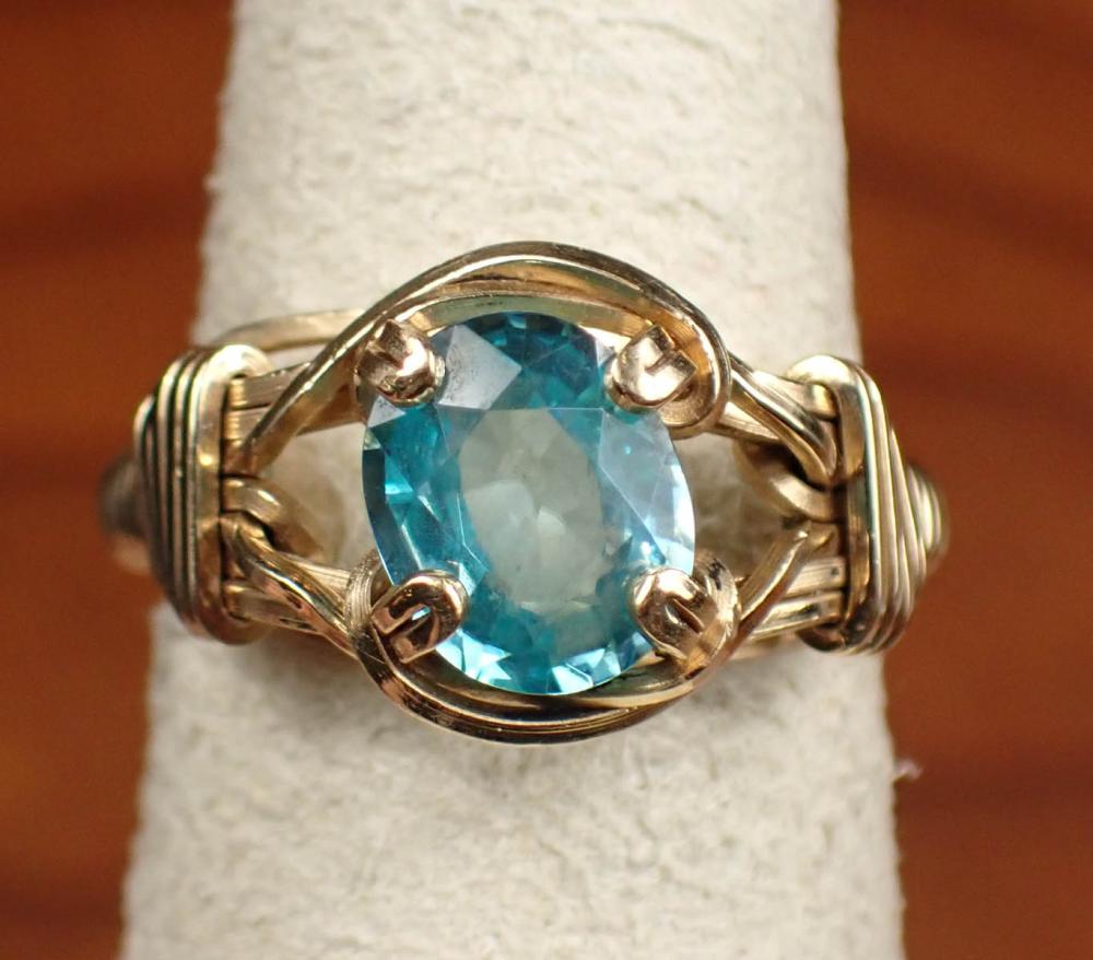 Appraisal: BLUE ZIRCON AND FOURTEEN KARAT YELLOW GOLD RING set with