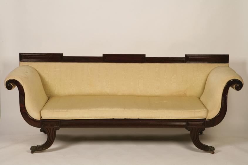 Appraisal: A REGENCY MAHOGANY DOUBLE SCROLL-END SETTEE with a reeded and