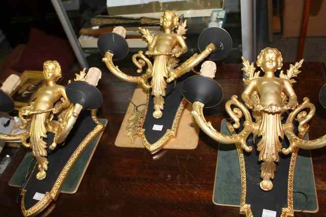 Appraisal: A PAIR OF EMPIRE STYLE GILT METAL AND BLACK PAINTED