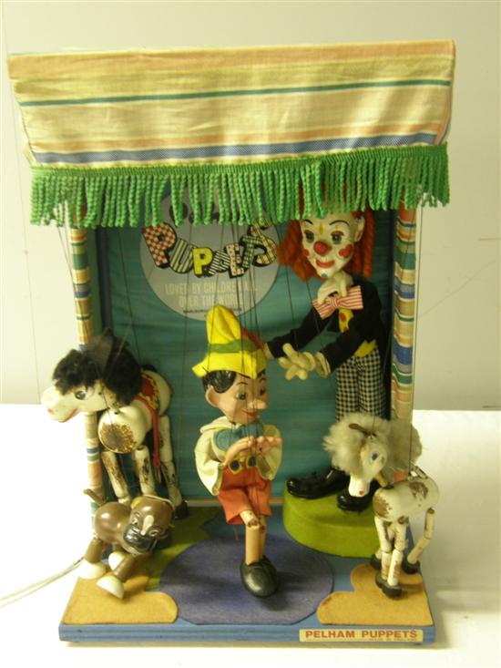 Appraisal: th century Pelham puppet battery powered working model with sign